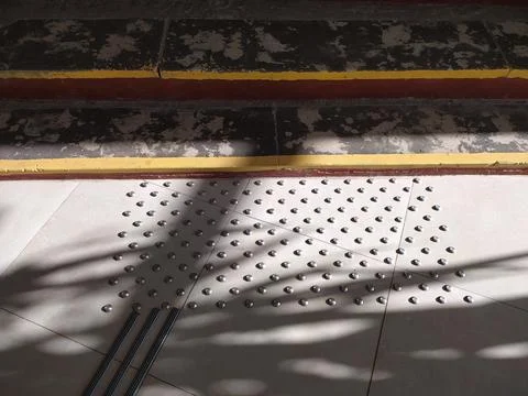 Tactile tiles with raised elements for visually impaired people Stock Photos