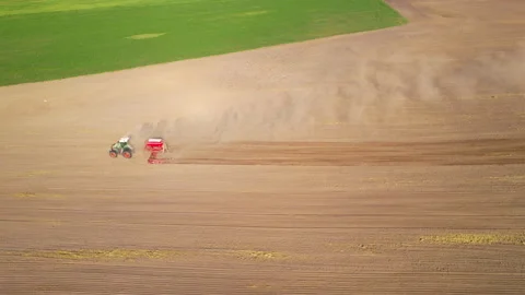 Tactor with disk harrow on plowing field. Sowing seed. Seeding Stock Footage 161417686