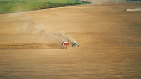 Tactor with disk harrow on plowing field. Sowing seed. Seeding Stock-Footage 161417766