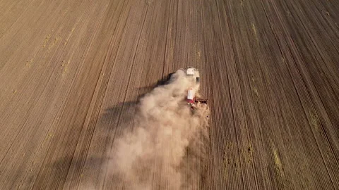 Tactor with disk harrow on plowing field. Sowing seed. Seeding 動画素材 161417902
