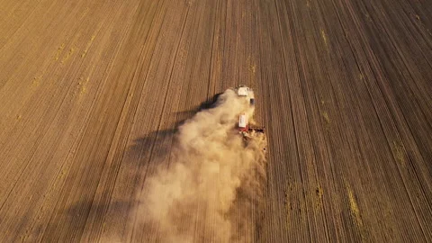 Tactor with disk harrow on plowing field. Sowing seed. Seeding Видео 161418560