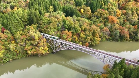 Tadami Line Train | First Tadami River Bridge | Autumn - 4K Aerial Video Stock Footage 329053253