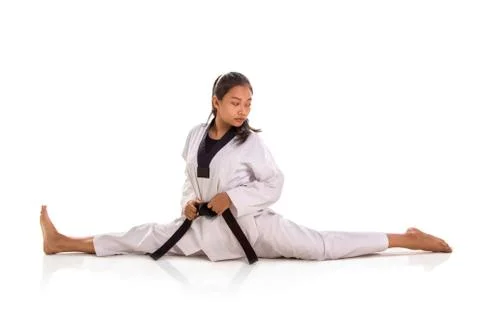 Tae-kwon-do girl split, turn her torso backward Stock Photos