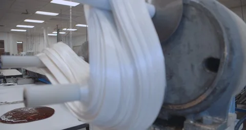 Taffy Puller At A Candy Factory In Slow Motion Stock Footage