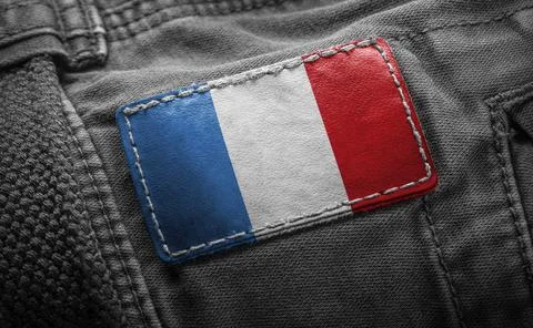 Tag on dark clothing in the form of the flag of the France 스톡 사진
