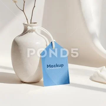 Tag mockup with string leaning against a clay pot in a minimalist setting PSD Template