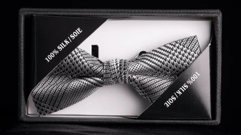 Tagged luxurious patterned silk bow tie in retail box Stock Footage 98404188