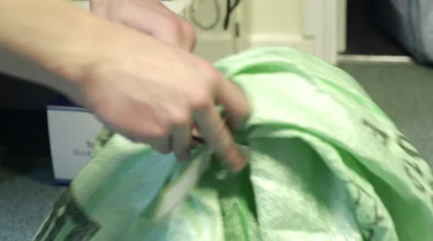 Tagging a Green Postage Bag Stock Footage 62680993