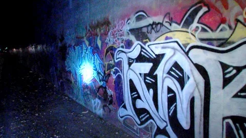 Tagging on tunnel along train line at night. Stock Footage 99370150