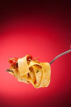 Tagliatelle with clams on a red background Stock Photos