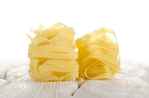 Tagliatelle on a white table Stock Photos