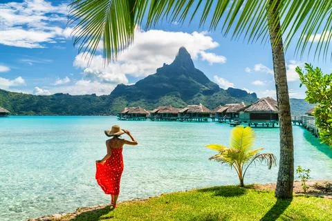 Tahiti travel holiday luxury hotel vacation tourist woman walking on Bora Bora Stock Photos