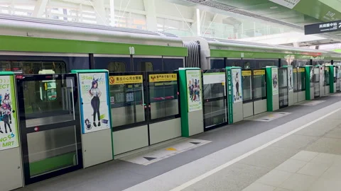Taichung MRT platform screen doors closing with train departure Taiwan metro Stock Footage 334574601