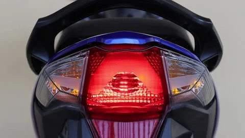 Tail light of motorcycle with left turn signal light and right turn signal light Stock Footage 145887045