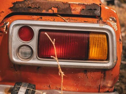 Tail light on old abandoned car Stock Photos