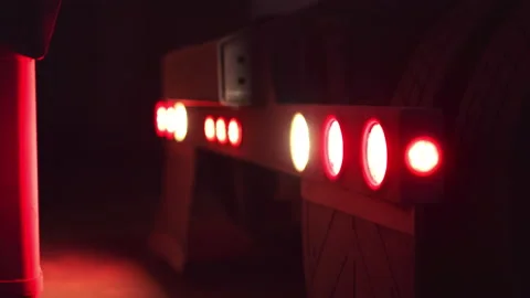 Tail lights blink on back of semi truck while backing up, with rack focus Video stock 204097416