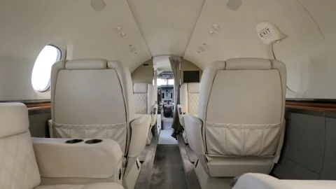Tail section of private jet revealing view on luxurious vip salon with bright Stock Footage 249741826