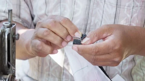 Tailor Adding Decorative Details to Clothing Stock Footage 345618842