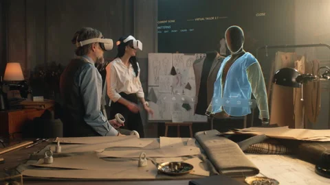 Tailor and customer watch 3D hologram of clothes pattern Stock Footage 232832523