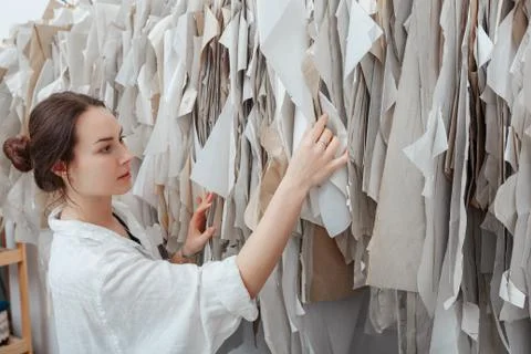 Tailor chooses what pattern to work. sewing workspace Stock Photos