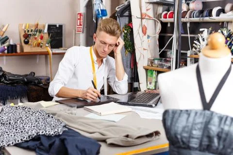 Tailor creating pattern using graphics tablet Stock Photos