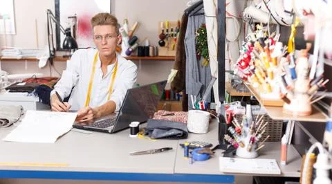 Tailor creating pattern using graphics tablet Stock Photos