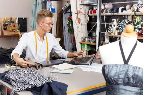 Tailor creating pattern using graphics tablet Stock Photos