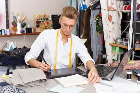 Tailor creating pattern using graphics tablet Stock Photos