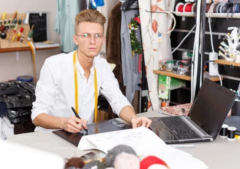 Tailor creating pattern using graphics tablet Stock Photos