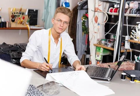 Tailor creating pattern using graphics tablet Stock Photos