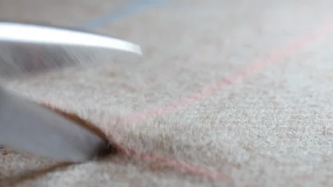 Tailor cut tweed wool textile fabric along chalk soap lines on pattern cutting. Stock Footage 129012272