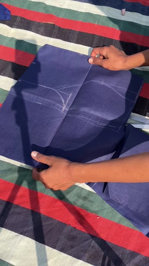 Tailor Cutting Blue Fabric with Scissors Following Chalk Markings 스톡 동영상 324893379