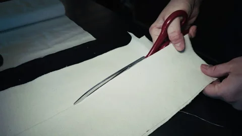 Tailor is Cutting Fabric With Scissors Stock Footage 329140421