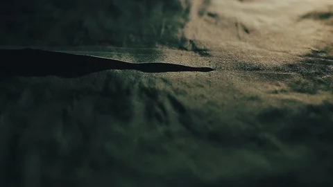 Tailor cutting fabric using large scissors or shears as he follows the chalk Video stock 86450184