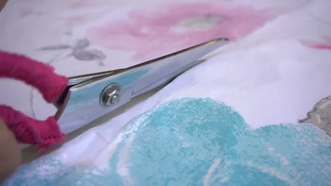 A tailor cutting a high quality fabric with scissors Stock Footage 81763479
