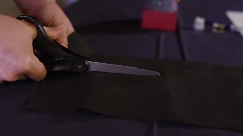 Tailor Cutting Out black Fabric Stock Footage 243613071