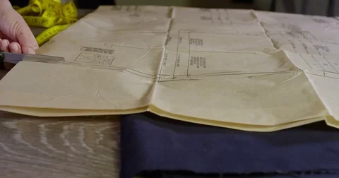 Tailor Cutting Patterns With Scissors 05 Stock Footage 84113549