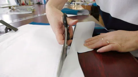 Tailor cutting the patterns with scissors Stock Footage 62351630