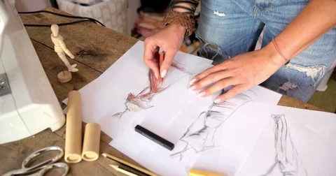 Tailor drawing sketches Stock Footage