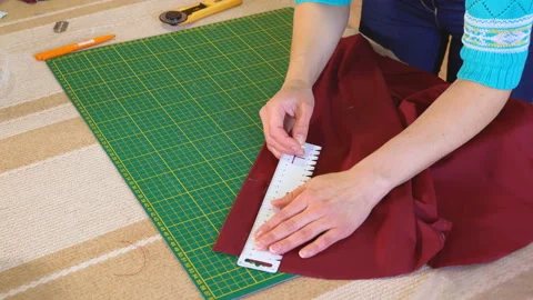 The tailor draws the markings on the cloth. Video stock 88814194