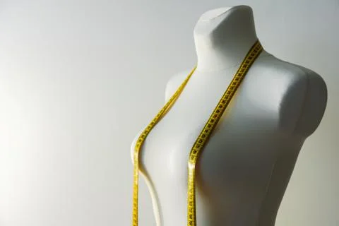 Tailor dummy with measuring tape Stock Photos