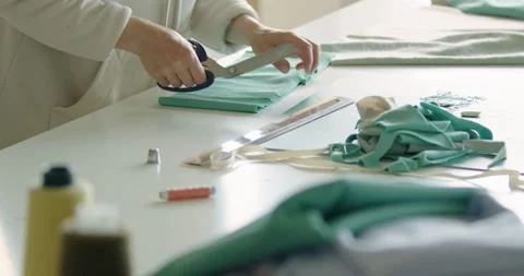 Tailor hands cutting material with scissors on table. Small business concept Stock Footage 200453607