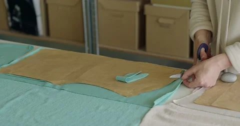 Tailor hands cutting material with scissors on table. Dressmaking concept Stock Footage 201196275