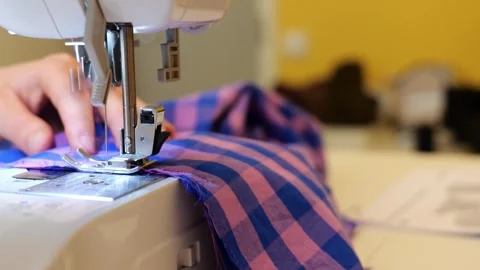 Tailor Hands Operating Modern Sewing Machine Stitching Fabric Cloth. Stock Footage 345312919
