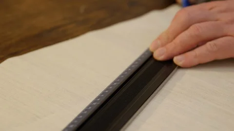 Tailor hands working with measure bar. Designing clothes, applying a template to Stock Footage 127252313