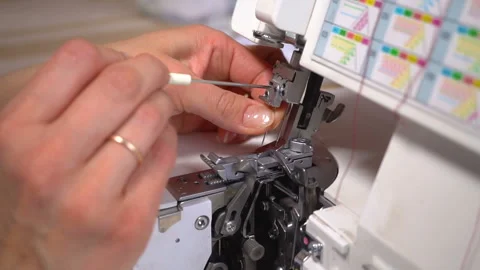 The tailor inserts the thread into the needle. Stock Footage 88806719
