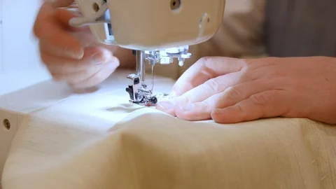 Tailor machine sewing The floating canvas, it adds structure to the front panel Stock Footage 127285277