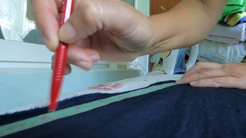 The tailor makes a mark on the fabric Video stock 93735592