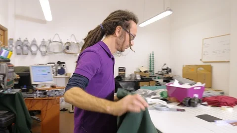 Tailor man working in his studio.Fabrics, handmade, tailor Stock Footage 115575710
