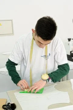 Tailor measuring necessary amount of material Foto stock